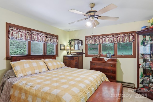 457 Shady Ridge Rd, Waynesville, NC 28785 - bedroom with baseboard heating, multiple windows, and ceiling fan