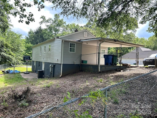 259 Oakland Heights Rd, Forest City, NC 28043 - view of side of home with cooling unit and an attached carport