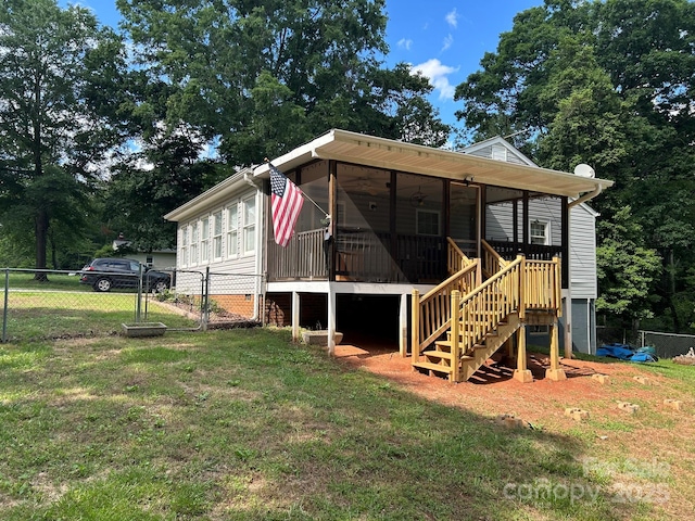 259 Oakland Heights Rd, Forest City, NC 28043 - rear view of house with stairway, a sunroom, and a gate