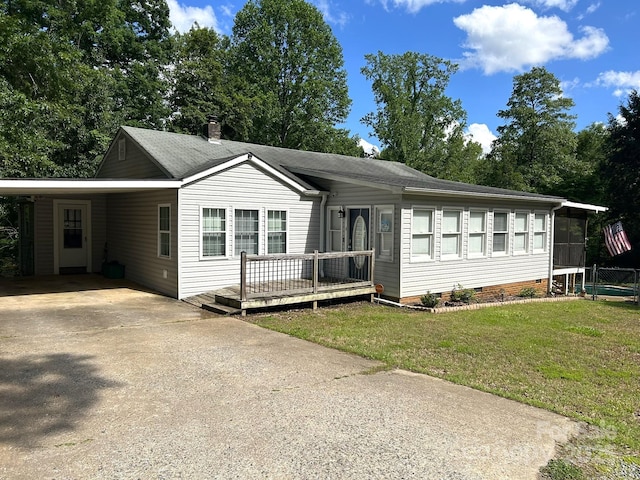 259 Oakland Heights Rd, Forest City, NC 28043 - ranch-style home with driveway, crawl space, a front lawn, an attached carport, and a sunroom