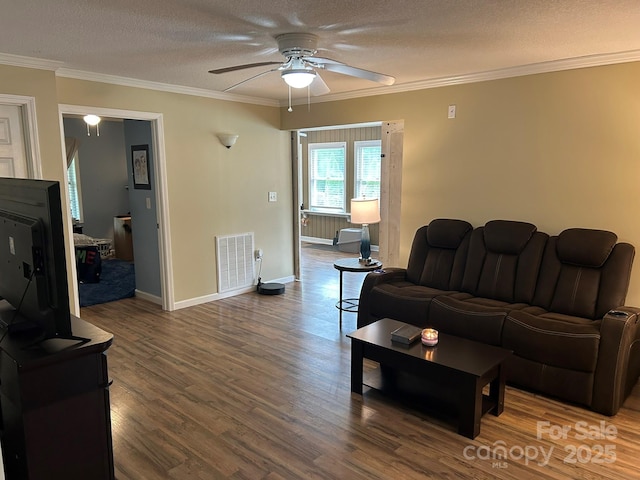259 Oakland Heights Rd, Forest City, NC 28043 - living area with ceiling fan, wood finished floors, crown molding, a textured ceiling, and baseboards