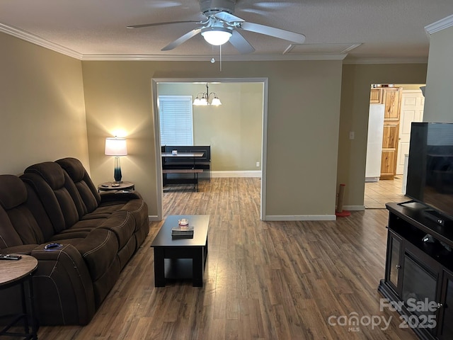 259 Oakland Heights Rd, Forest City, NC 28043 - living area featuring ceiling fan, wood finished floors, ornamental molding, and baseboards