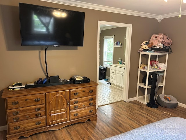 259 Oakland Heights Rd, Forest City, NC 28043 - bedroom with dark wood-type flooring, crown molding, baseboards, and ensuite bathroom