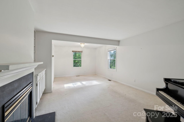 124 Hilltop Rd, Black Mountain, NC 28711 - unfurnished living room featuring light carpet and baseboards