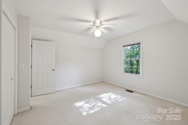 124 Hilltop Rd, Black Mountain, NC 28711 - unfurnished bedroom with lofted ceiling, carpet flooring, baseboards, and ceiling fan
