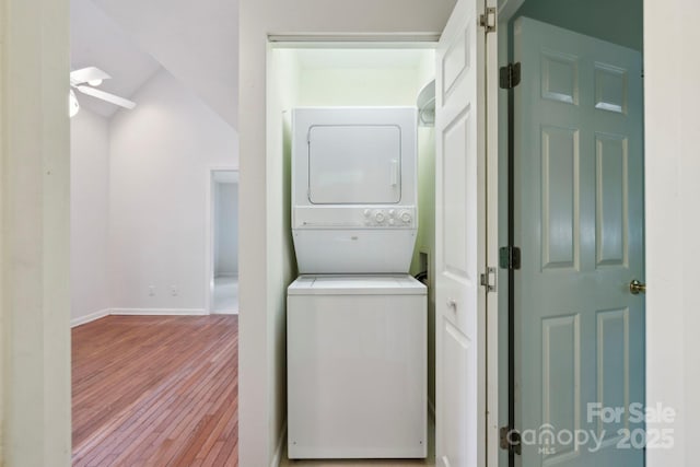 124 Hilltop Rd, Black Mountain, NC 28711 - clothes washing area with stacked washer and clothes dryer, wood finished floors, baseboards, and a ceiling fan