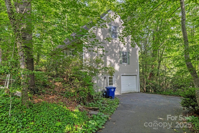 124 Hilltop Rd, Black Mountain, NC 28711 - view of property exterior featuring asphalt driveway and a garage