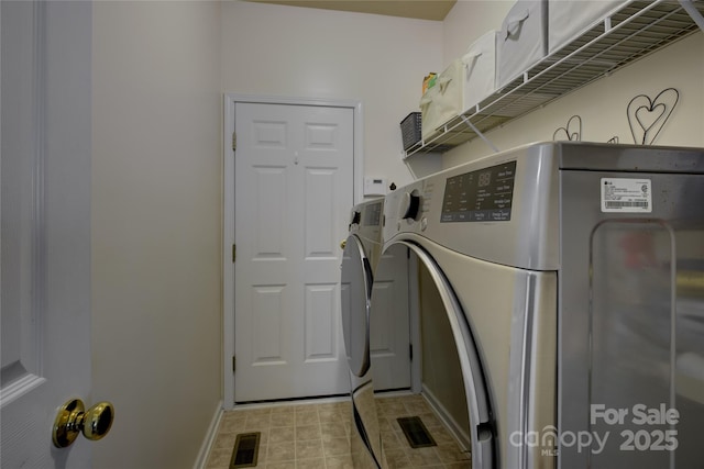 12125 Mountainside Ln, Charlotte, NC 28278 - laundry room with separate washer and dryer and baseboards
