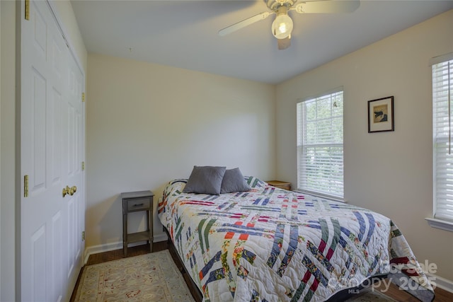 12125 Mountainside Ln, Charlotte, NC 28278 - bedroom with wood finished floors, baseboards, and a ceiling fan