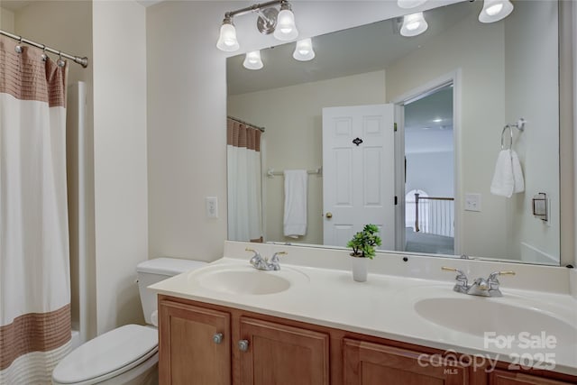 12125 Mountainside Ln, Charlotte, NC 28278 - bathroom with double vanity, toilet, and shower / bath combination with curtain