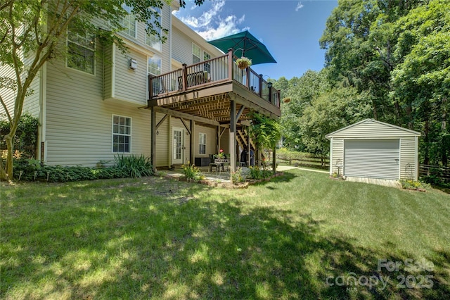 12125 Mountainside Ln, Charlotte, NC 28278 - back of house featuring a wooden deck, a lawn, a detached garage, a patio area, and an outbuilding
