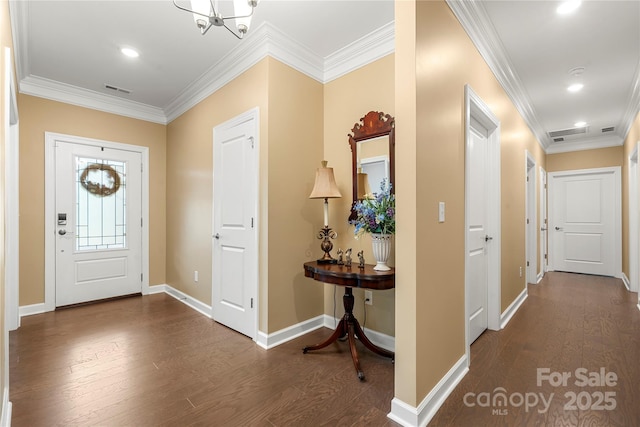 17028 River Race Dr, Huntersville, NC 28078 - foyer entrance with dark wood-style floors, crown molding, baseboards, a chandelier, and recessed lighting