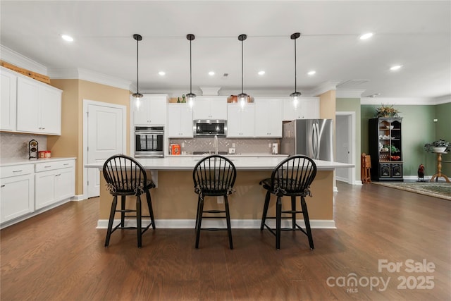 17028 River Race Dr, Huntersville, NC 28078 - kitchen featuring appliances with stainless steel finishes, backsplash, white cabinets, light countertops, and ornamental molding