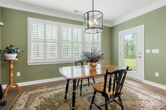 17028 River Race Dr, Huntersville, NC 28078 - dining area featuring a chandelier, wood finished floors, ornamental molding, and baseboards