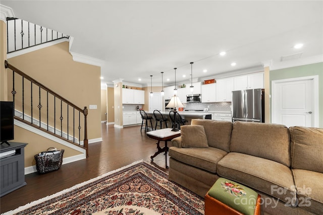 17028 River Race Dr, Huntersville, NC 28078 - living area featuring dark wood-style flooring, crown molding, recessed lighting, stairway, and baseboards