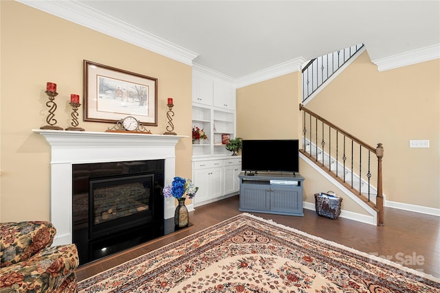 17028 River Race Dr, Huntersville, NC 28078 - living area with dark wood-type flooring, ornamental molding, stairs, a glass covered fireplace, and baseboards