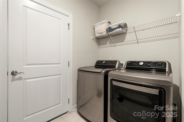 17028 River Race Dr, Huntersville, NC 28078 - washroom featuring separate washer and dryer and light tile patterned floors