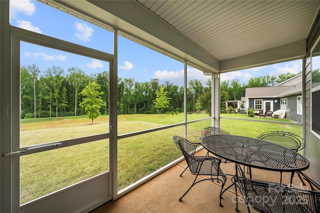 17028 River Race Dr, Huntersville, NC 28078 - sunroom with view of scattered trees and outdoor dining area