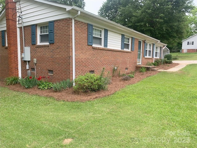 304 W Miller St, Jefferson, SC 29718 - view of front facade with crawl space, a front yard, and brick siding