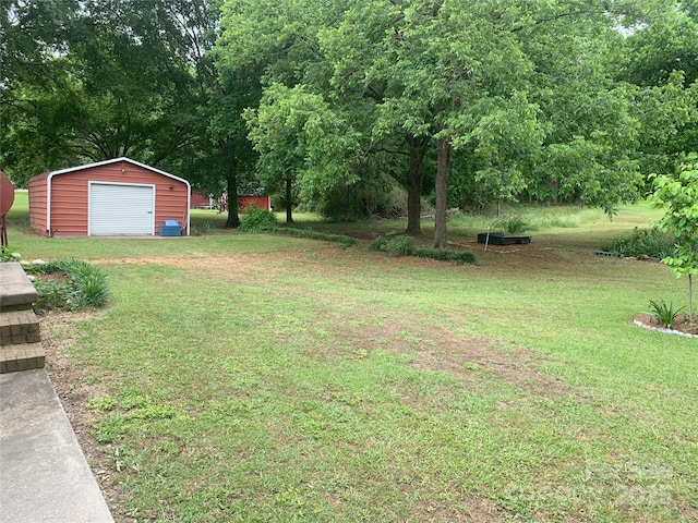 304 W Miller St, Jefferson, SC 29718 - view of grassy yard featuring an outbuilding and a detached garage