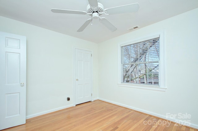 101 S Laurel Ave Unit 72A, Charlotte, NC 28207 - unfurnished room featuring baseboards, light wood-type flooring, and ceiling fan