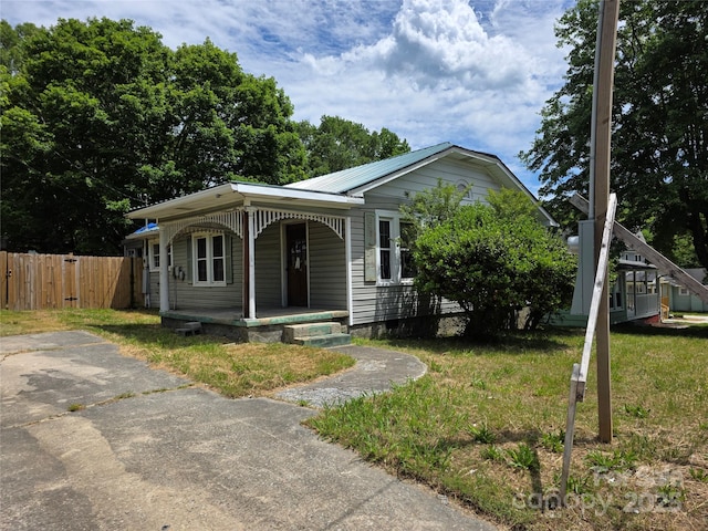 503 Reid St, Thomasville, NC 27360 - view of front facade featuring a porch and metal roof