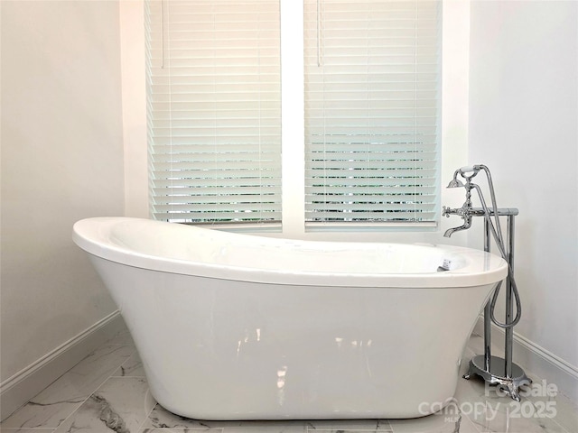 690 Settlers Trl, Mars Hill, NC 28754 - bathroom with baseboards, marble finish flooring, and a soaking tub