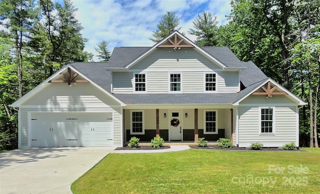 690 Settlers Trl, Mars Hill, NC 28754 - view of front of home with an attached garage, a porch, concrete driveway, a front yard, and a shingled roof