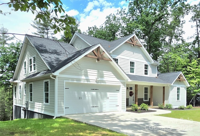 690 Settlers Trl, Mars Hill, NC 28754 - view of front of property featuring a garage, driveway, a front lawn, covered porch, and a shingled roof