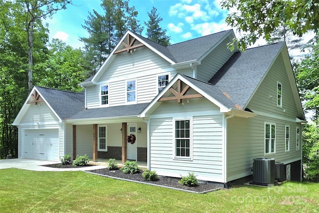 690 Settlers Trl, Mars Hill, NC 28754 - view of front of property with cooling unit, an attached garage, covered porch, driveway, and a shingled roof