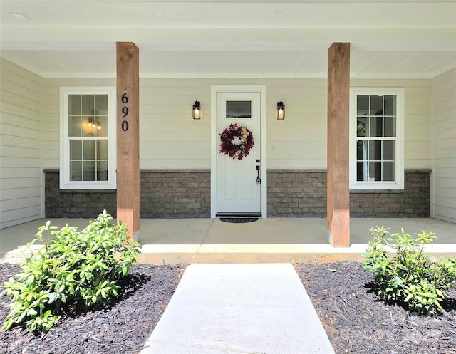 690 Settlers Trl, Mars Hill, NC 28754 - view of exterior entry with covered porch and stone siding