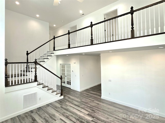 690 Settlers Trl, Mars Hill, NC 28754 - stairs featuring wood finished floors, a towering ceiling, recessed lighting, baseboards, and ceiling fan