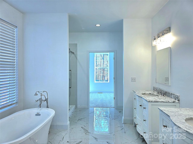 690 Settlers Trl, Mars Hill, NC 28754 - full bathroom with baseboards, two vanities, a freestanding tub, a shower stall, and recessed lighting