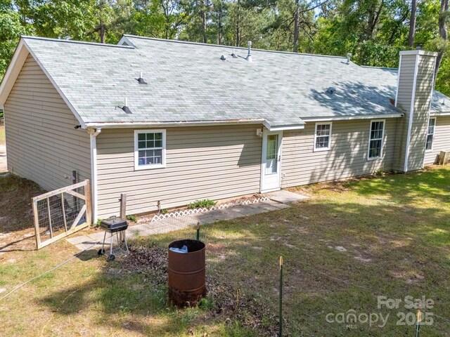 2675 Andrews Cir, Aiken, SC 29803 - rear view of property with a chimney and a lawn
