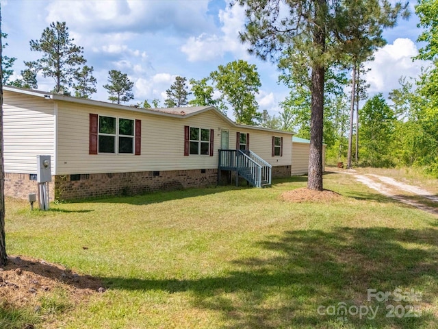 2675 Andrews Cir, Aiken, SC 29803 - manufactured / mobile home featuring crawl space, a front lawn, and dirt driveway