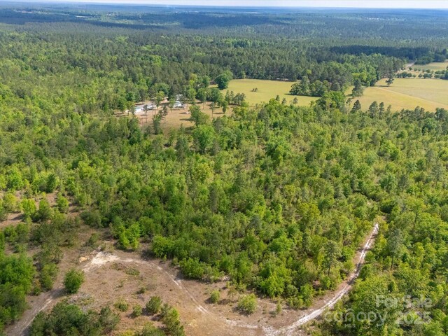 2675 Andrews Cir, Aiken, SC 29803 - aerial view of property and surrounding area with a heavily wooded area
