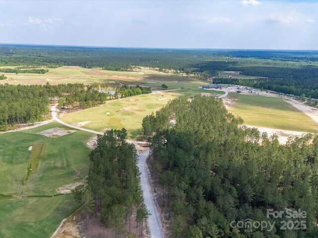 2675 Andrews Cir, Aiken, SC 29803 - aerial view of property and surrounding area featuring a golf course and a heavily wooded area