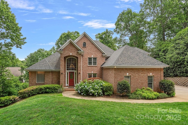 166 Pinnacle Shores Dr, Mooresville, NC 28117 - traditional-style home with a shingled roof, brick siding, and a front lawn