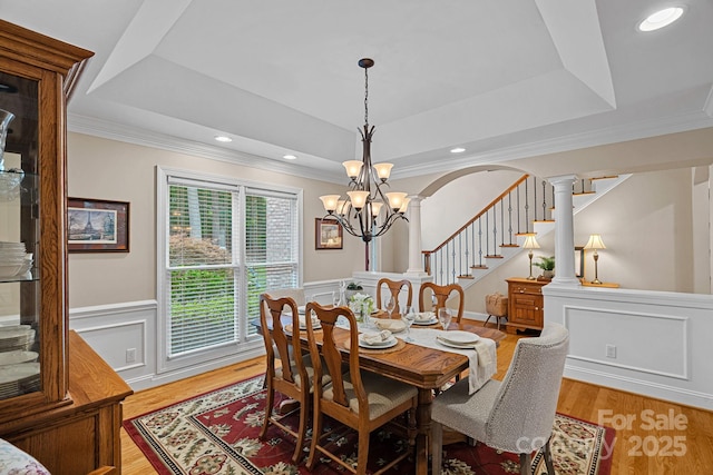 166 Pinnacle Shores Dr, Mooresville, NC 28117 - dining room with a raised ceiling, a chandelier, a decorative wall, ornamental molding, and a wainscoted wall