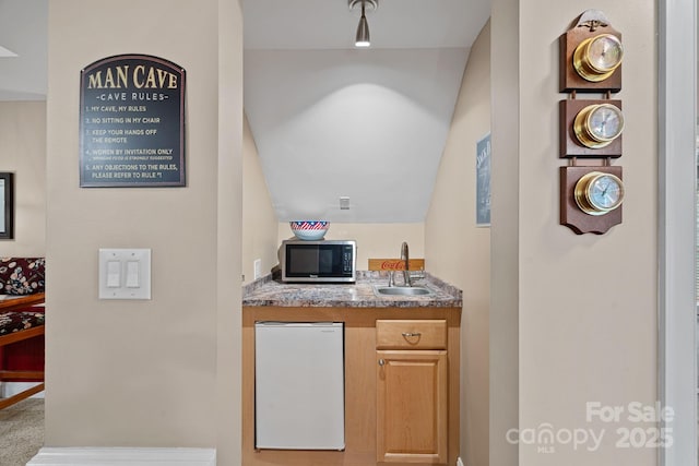 166 Pinnacle Shores Dr, Mooresville, NC 28117 - indoor wet bar featuring stainless steel microwave, fridge, and vaulted ceiling