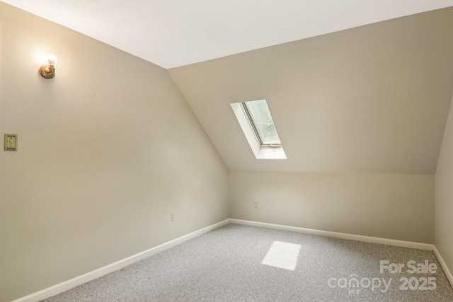 19 Reuben Branch Rd, Maggie Valley, NC 28751 - additional living space featuring a skylight, vaulted ceiling, baseboards, and light carpet