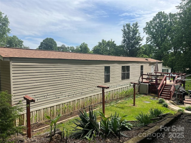 2165 Peanuts Ln, Newton, NC 28658 - view of property exterior with a wooden deck, central air condition unit, and roof with shingles
