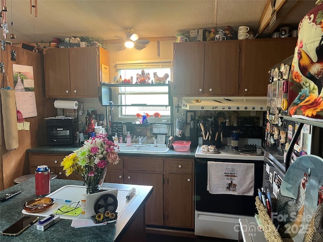 2165 Peanuts Ln, Newton, NC 28658 - kitchen with white electric range, a sink, ceiling fan, dark countertops, and a textured ceiling