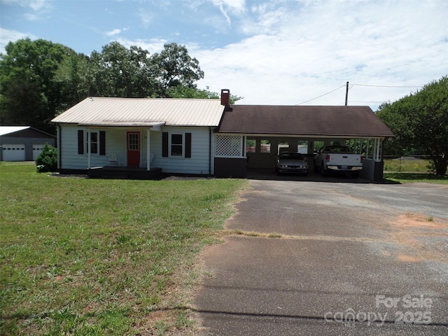5004 King Wilkinson Rd, Denver, NC 28037 - view of front of home with asphalt driveway, covered porch, a front lawn, a carport, and a chimney