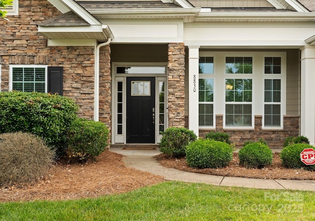 entrance to property with stone siding