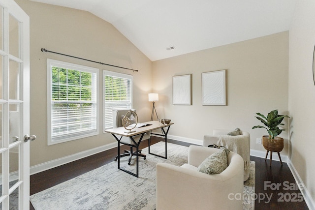 home office with lofted ceiling, wood finished floors, french doors, and baseboards
