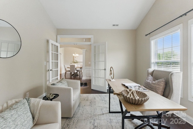 home office featuring french doors, a chandelier, wood finished floors, and baseboards