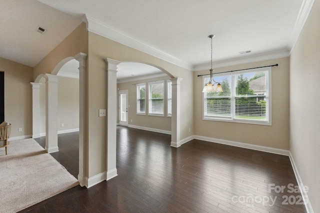 unfurnished living room with arched walkways, decorative columns, dark wood finished floors, crown molding, and baseboards