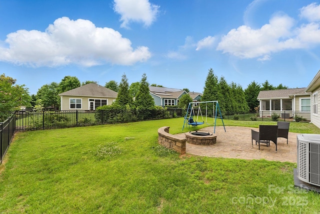 view of yard with a patio, a playground, and central air condition unit