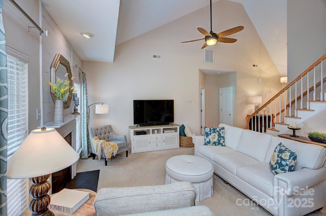5748 Timbertop Ln, Charlotte, NC 28215 - carpeted living area featuring a ceiling fan, stairs, and high vaulted ceiling